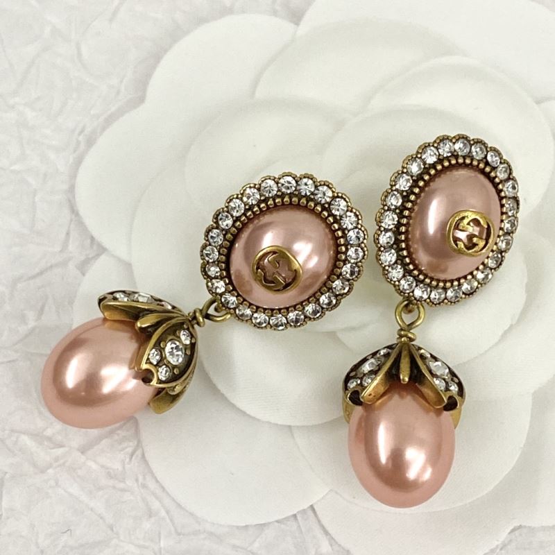G*u*i earrings